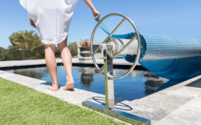 What is a solar pool cover and how can it help heat my pool?